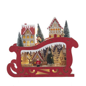 13.77" Battery Operated LED Lighted Sleigh With Village Scene Table Piece