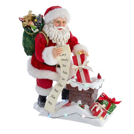 10.5" Fabriche Battery-Operated Santa Next To Lit Chimney