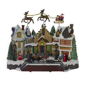 16" White and Brown LED Lighted and Animated Christmas Village with Flying Sleigh Tabletop Decor