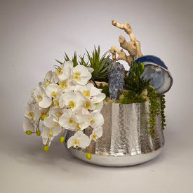 Draped White Orchids with Blue Calcite in Silver Embellished Container